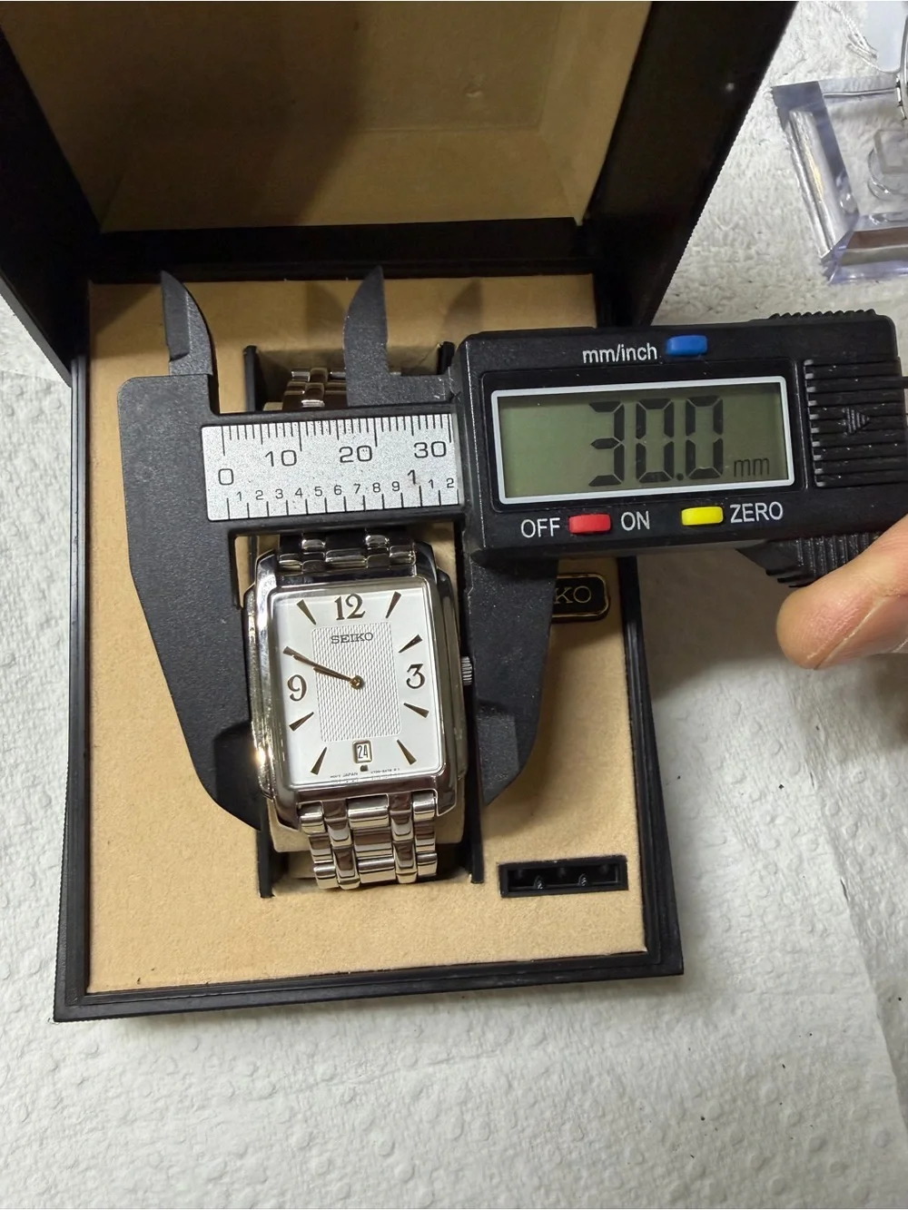 Seiko Silver Watch with Gold Accents and Rectangular Dial